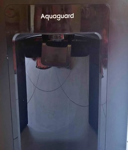 Aquaguard Sure Delight 2X RO water purifier front view highlighting the dispensing tap and outlet area
