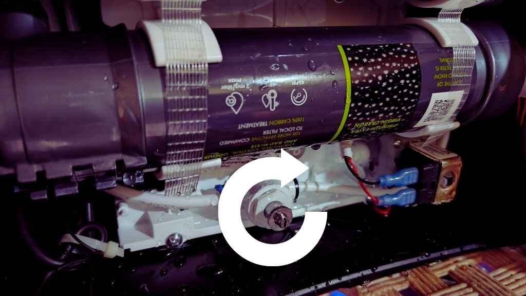 Close-up of the TDS adjuster knob inside an Aquaguard RO water purifier, highlighting the adjustment point for TDS control.