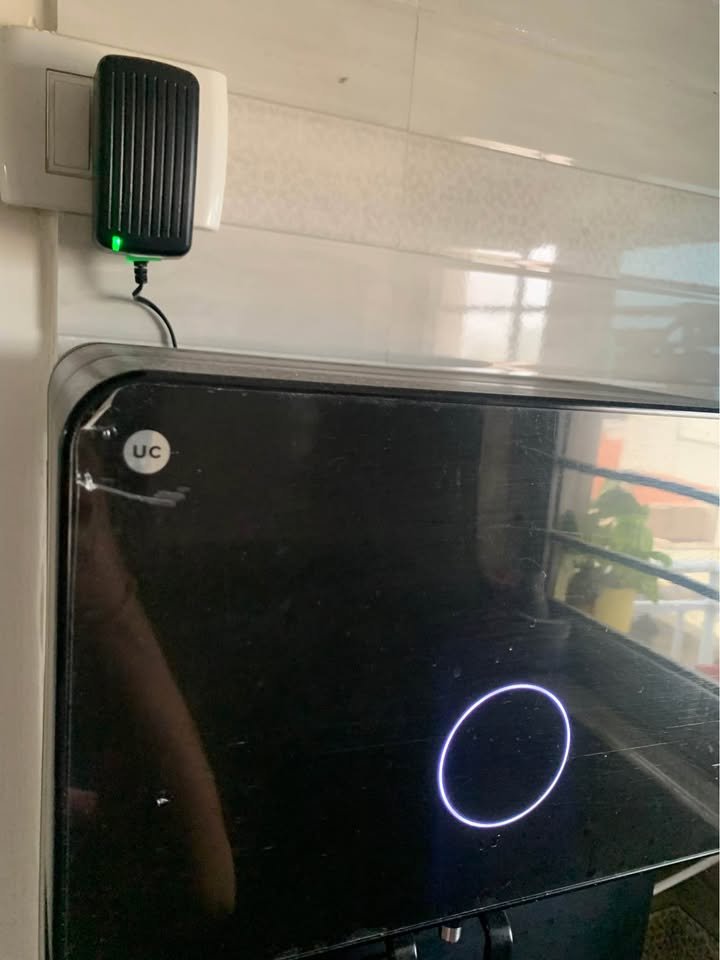 UC Native M1 RO purifier front panel showing the circular running status glow light (LED ring) illuminated to indicate the unit is powered and operating